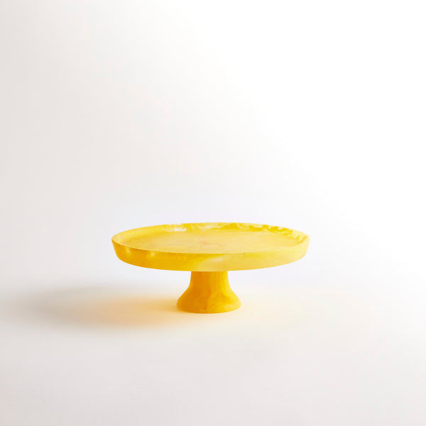 Yellow marbled resin cake stand.