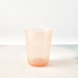 Peach bubble glass tumbler.