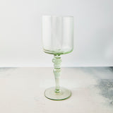 Clear light green wine glass.