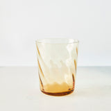 Clear light amber tumbler.