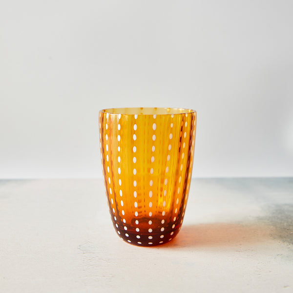 Amber and white dotted tumbler.