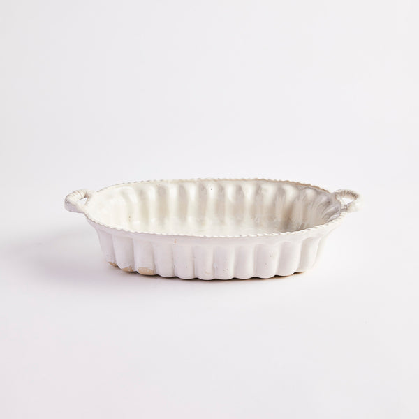White baking dish with handles.