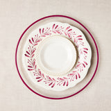 Dark pink charger and White with dark pink garland mixed plates.