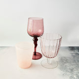 Blush with white dotted and ruby wine glass with soft pink tumbler.