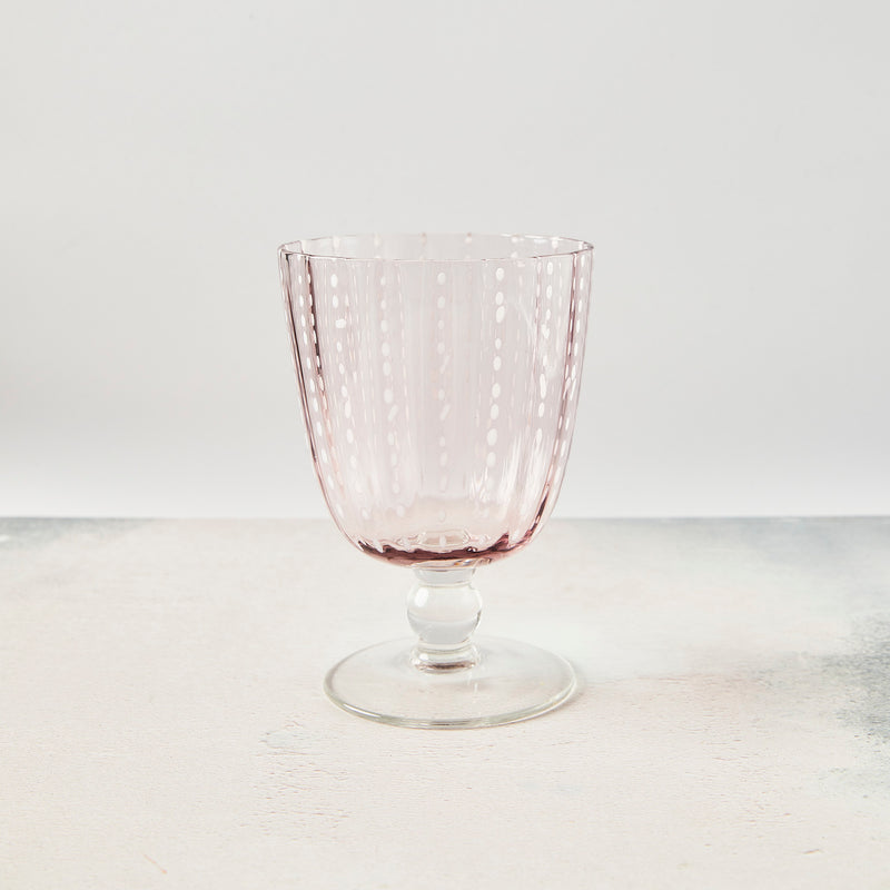 Blush and white dotted wine glass.
