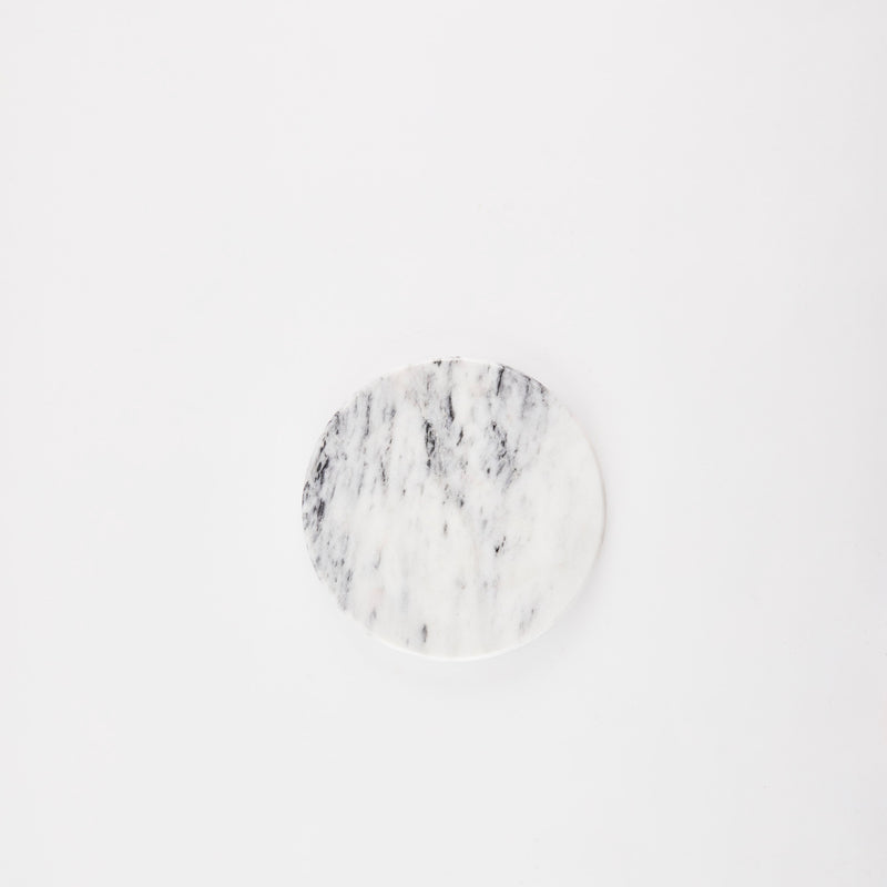 White and grey marble circular board.