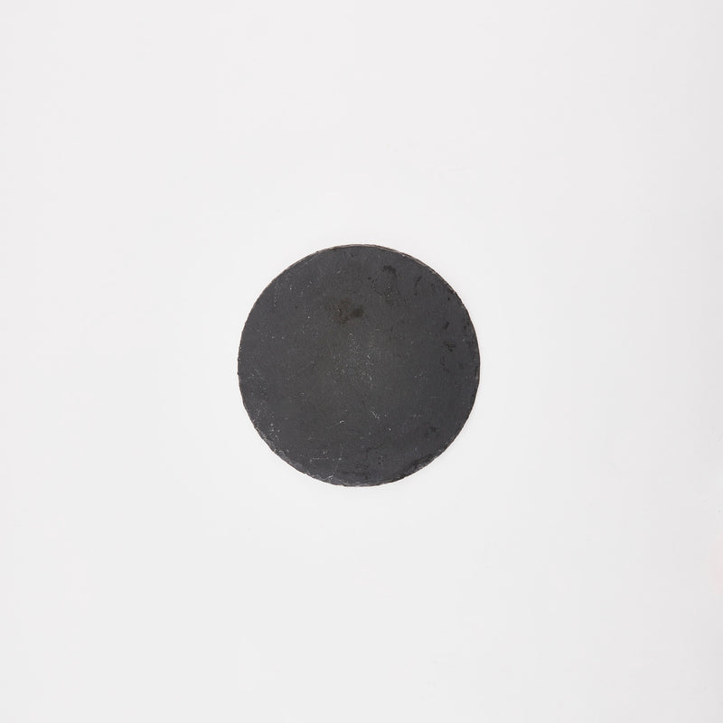 Circular black slate board.