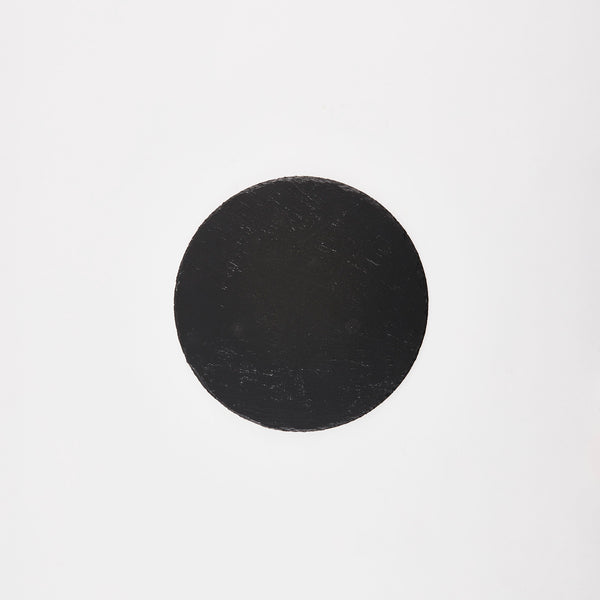 Circular black slate board.