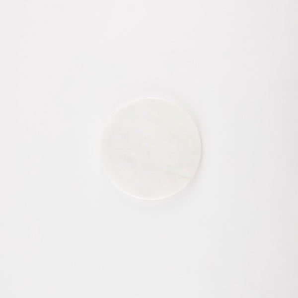 Circular white marble board.