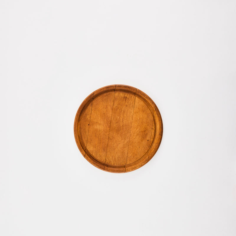 Circular wooden board.