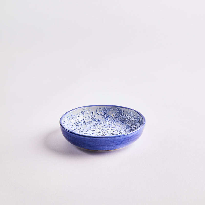 Blue with light blue embossed decorative inside bowl.