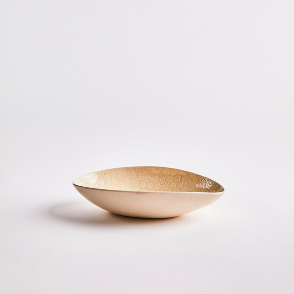 Cream with embossed inside bowl.