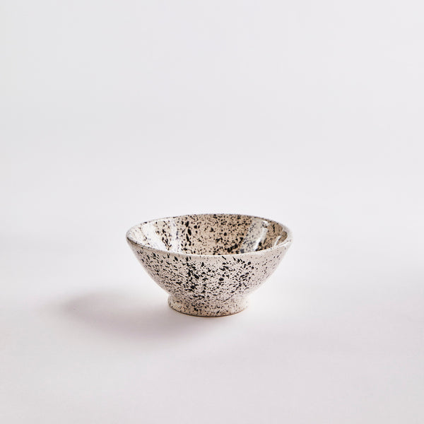 Black and white speckled bowl.