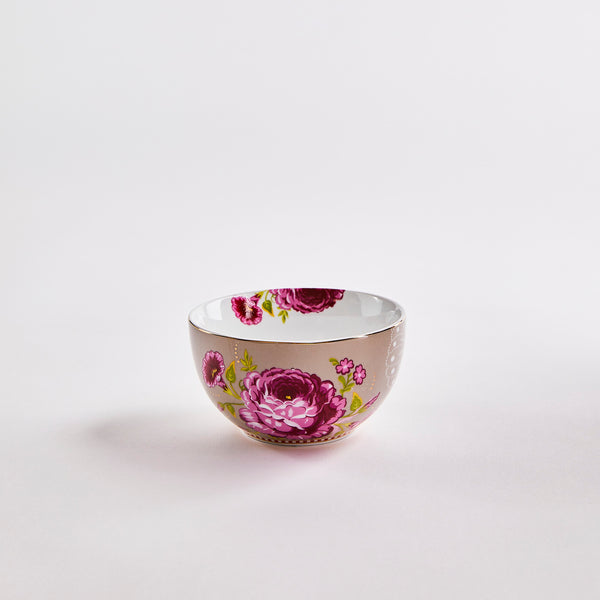 Grey bowl with pink, purple and white floral design on the interior and exterior.