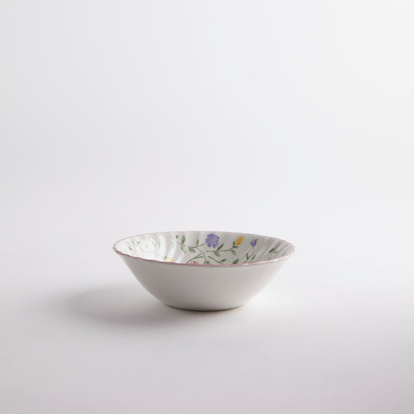 White bowl with multicoloured floral interior.