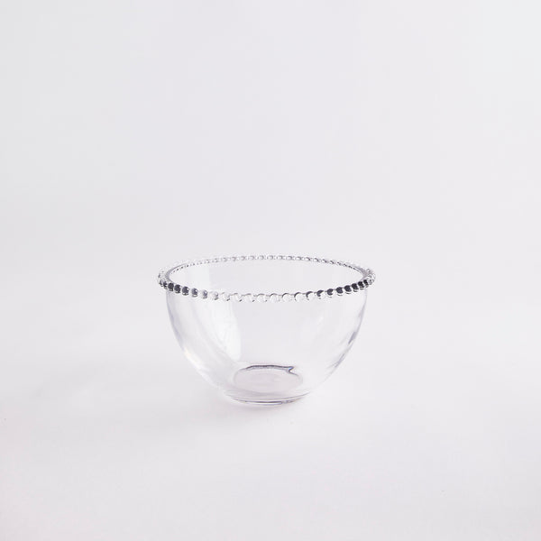 Clear glass bowl with beaded rim.