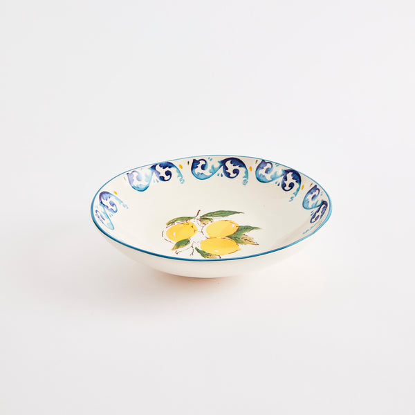 White bowl with blue and yellow lemon design.