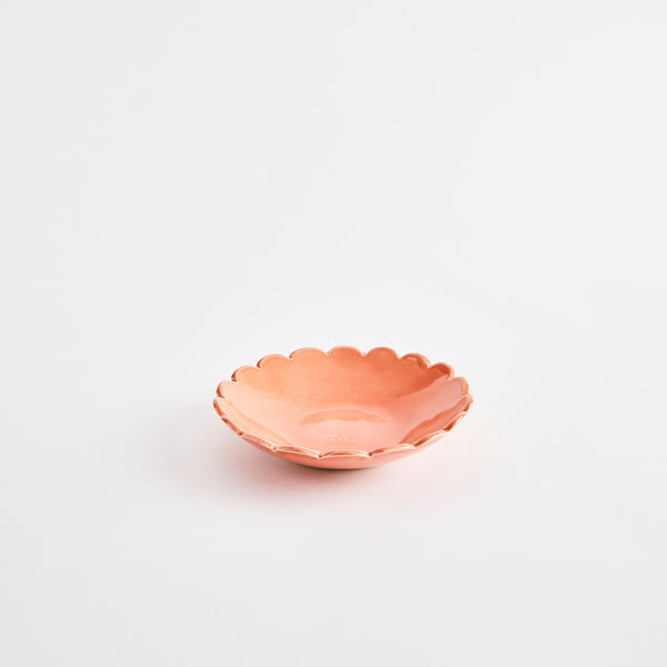 Orange scalloped edge bowl.