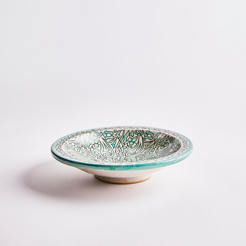 Green and cream Moroccan decorative bowl.