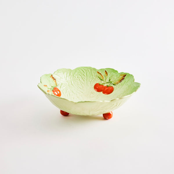 Green bowl with red tomato design.