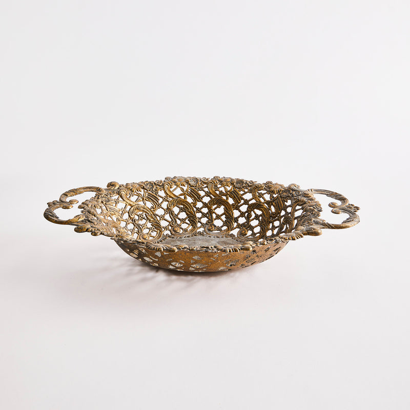 Dark gold bowl with intricate design. 