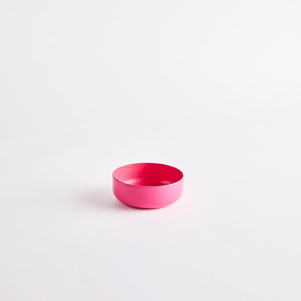 Pink metal bowl.