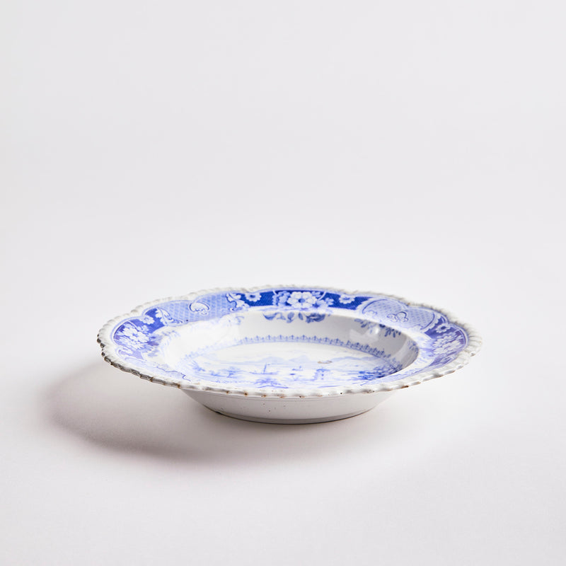 White with blue decoration inside bowl.