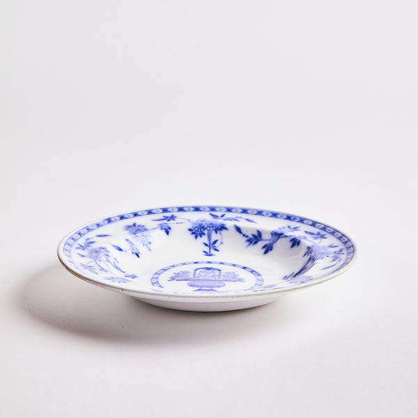 White with blue decoration inside bowl.