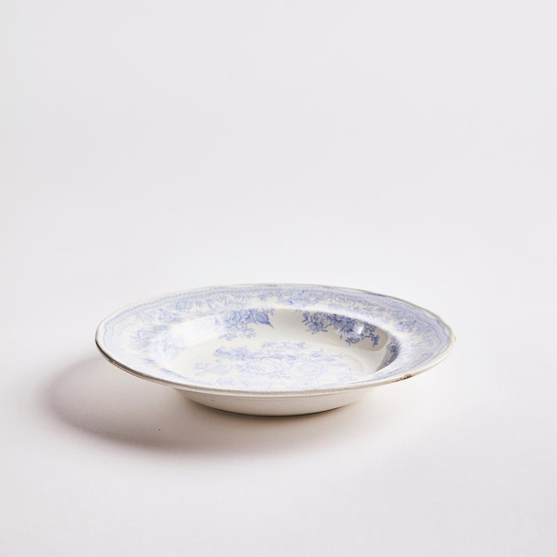 White with light blue decoration inside bowl.