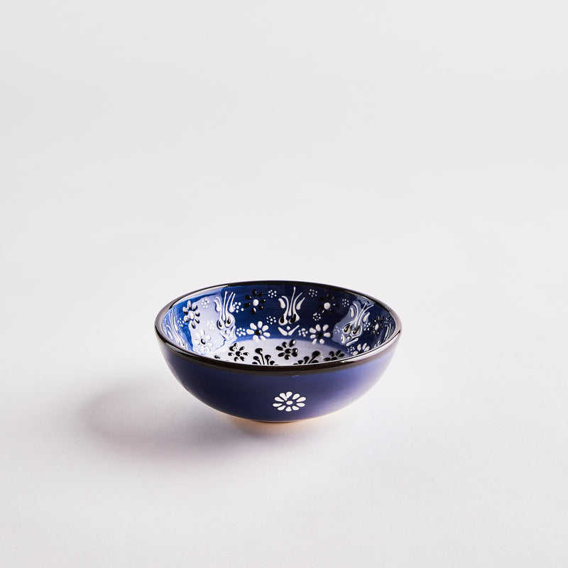 Dark blue with decorative inside bowl.