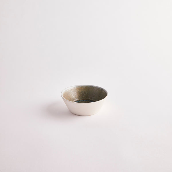Cream bowl with darker interior.