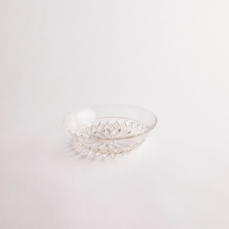 Clear glass bowl with etched design.