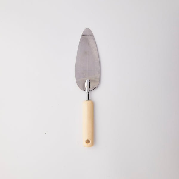 Silver and cream cake slicer.