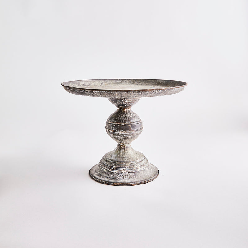 Grey metal cake stand.