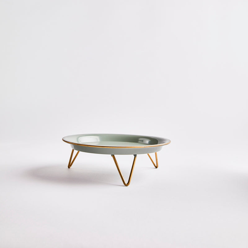 Green with gold hairpin legs cake stand.