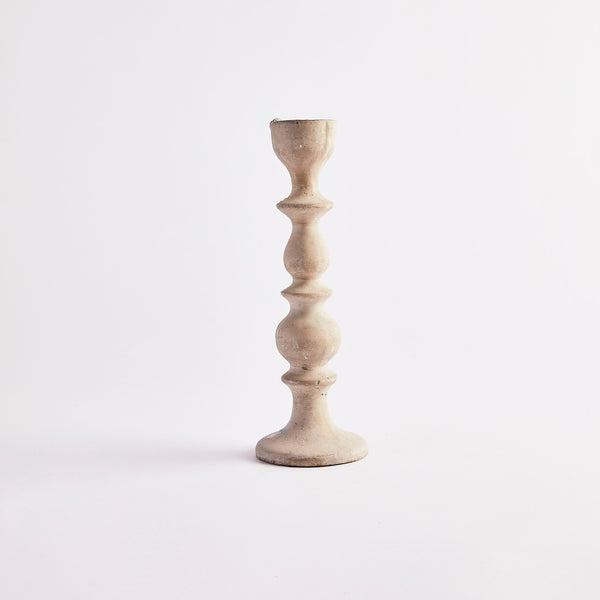 Beige tier candle holder.