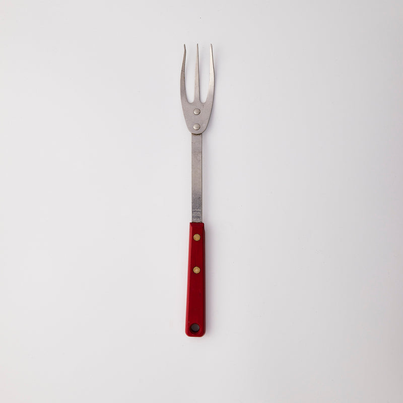 Silver with red handle carving fork.