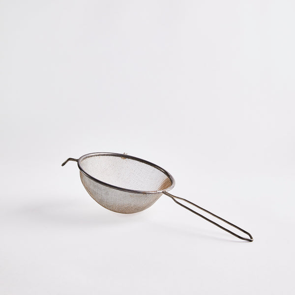 Silver sieve.