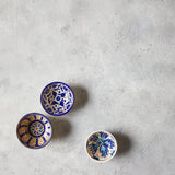 Top view of mixed pattern blue bowls on Concrete Background.