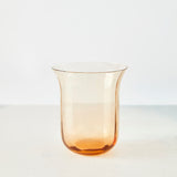 Orange glass tumbler.