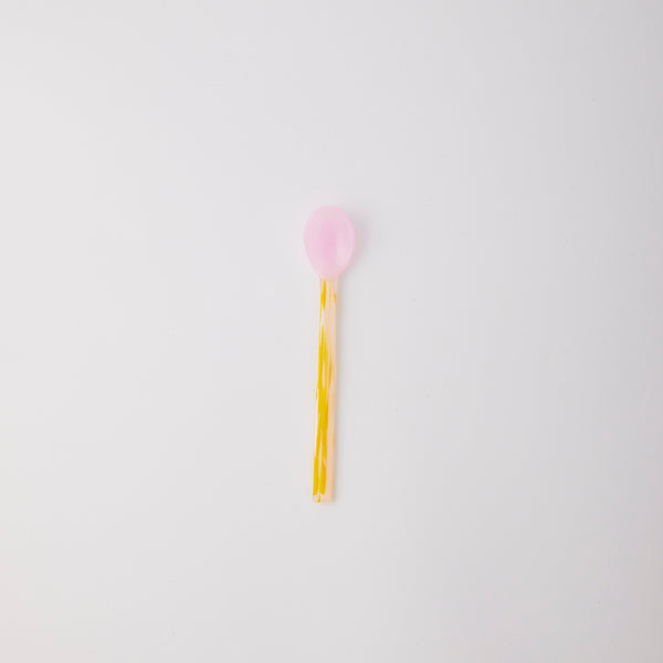 Pink and yellow spoon.
