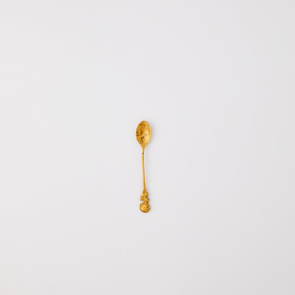 Mini gold spoon. 
