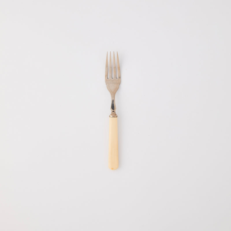 Silver fork with cream handle. 