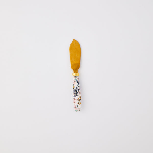 Gold knife with multicoloured floral detail handle. 