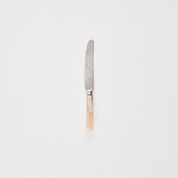 Silver knife with pearl handle.