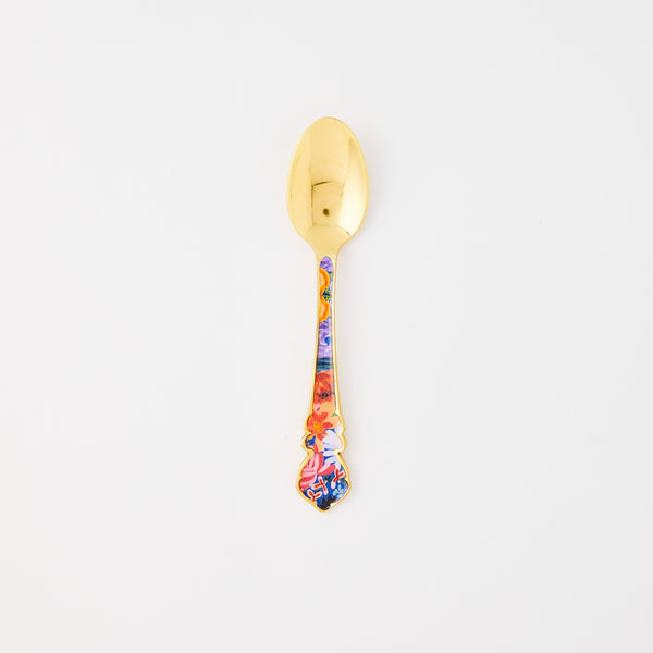 Gold spoon with multi floral handle.