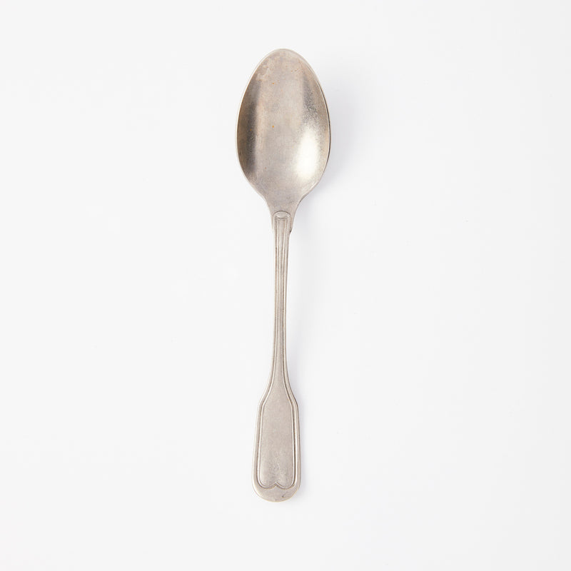 Brushed silver spoon.