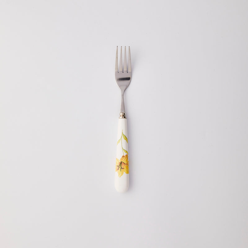 Silver fork with white and yellow handle. 