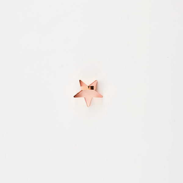 Rose gold star cutter with handle.