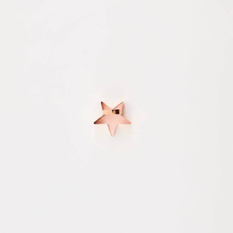 Rose gold star cutter with handle.
